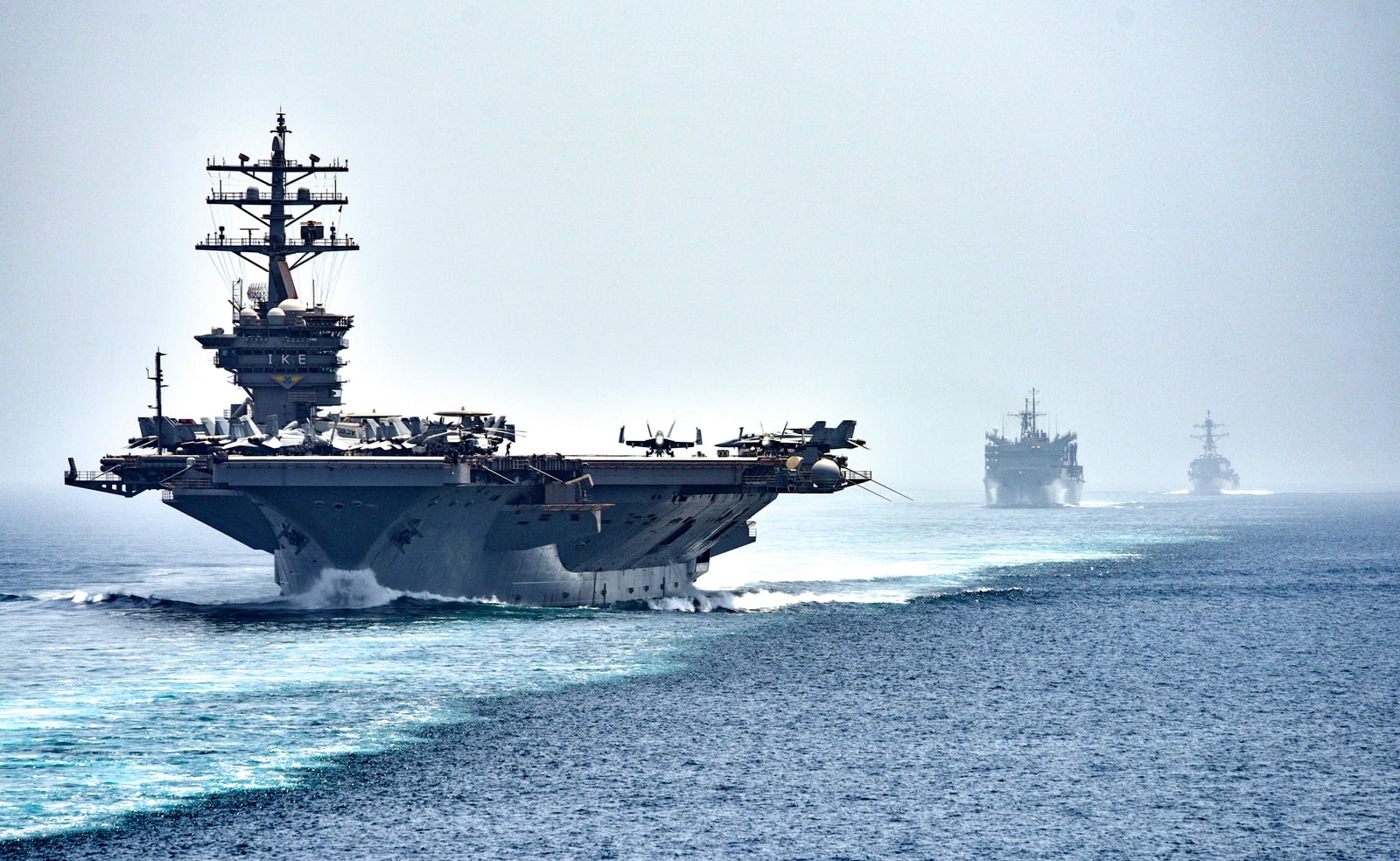 STRAIT OF HORMUZ (July 21, 2016) The aircraft carrier USS Dwight D. Eisenhower (CVN 69), followed by the fast combat support ship USNS Arctic (T-AOE 8) and the guided-missile destroyer USS Nitze (DDG 